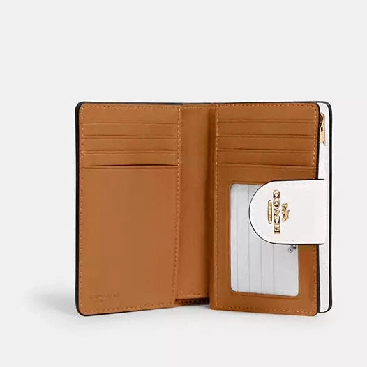 Cartera mediana con cremallera en las esquinas de Coach