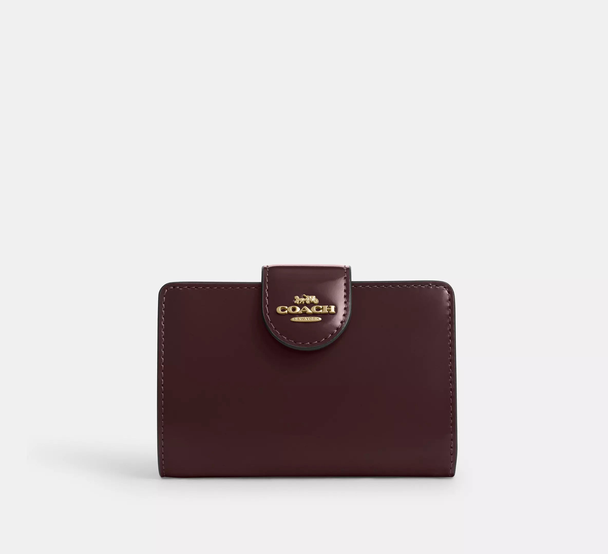 Cartera mediana con cremallera en las esquinas de Coach