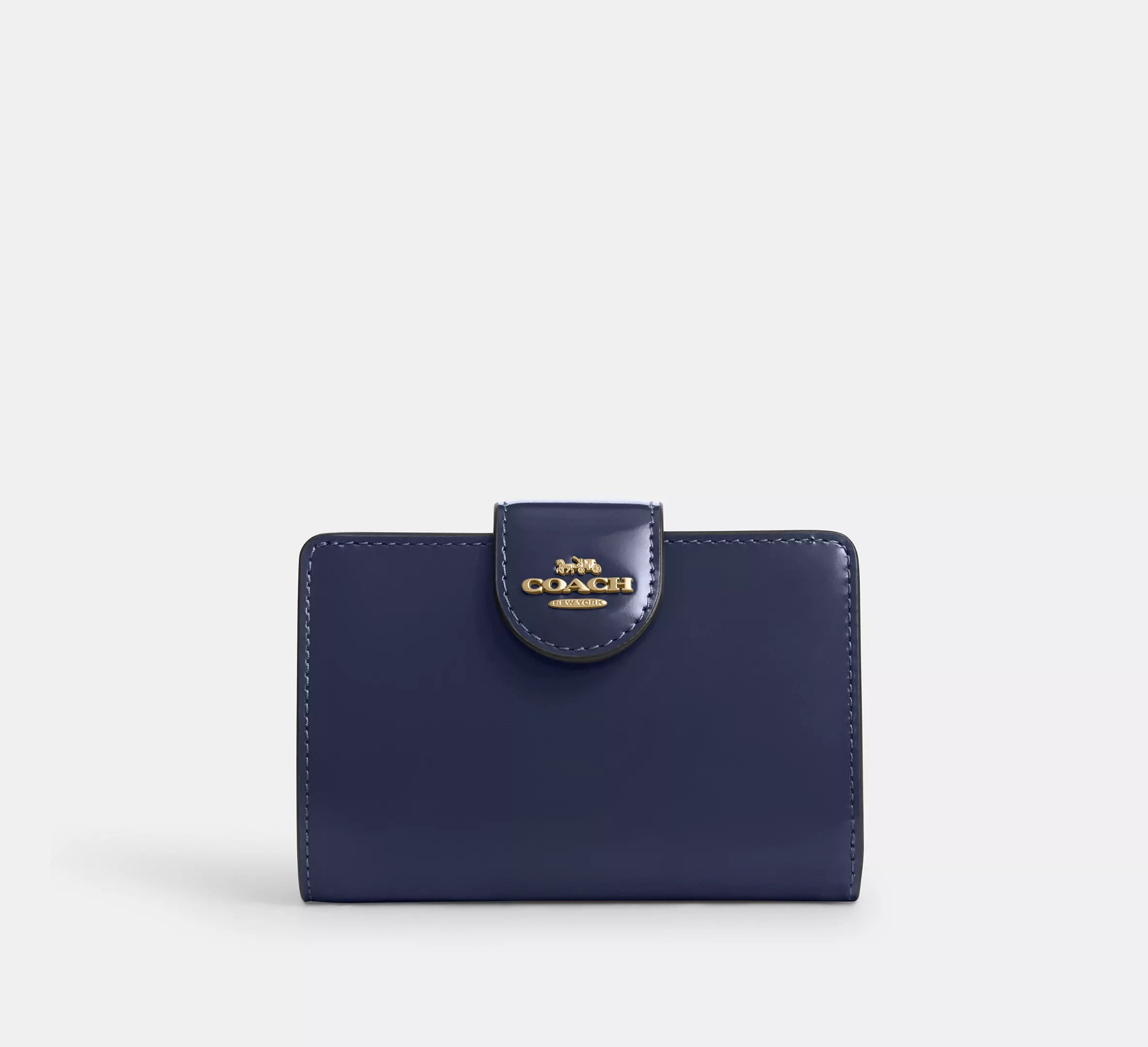 Cartera mediana con cremallera en las esquinas de Coach