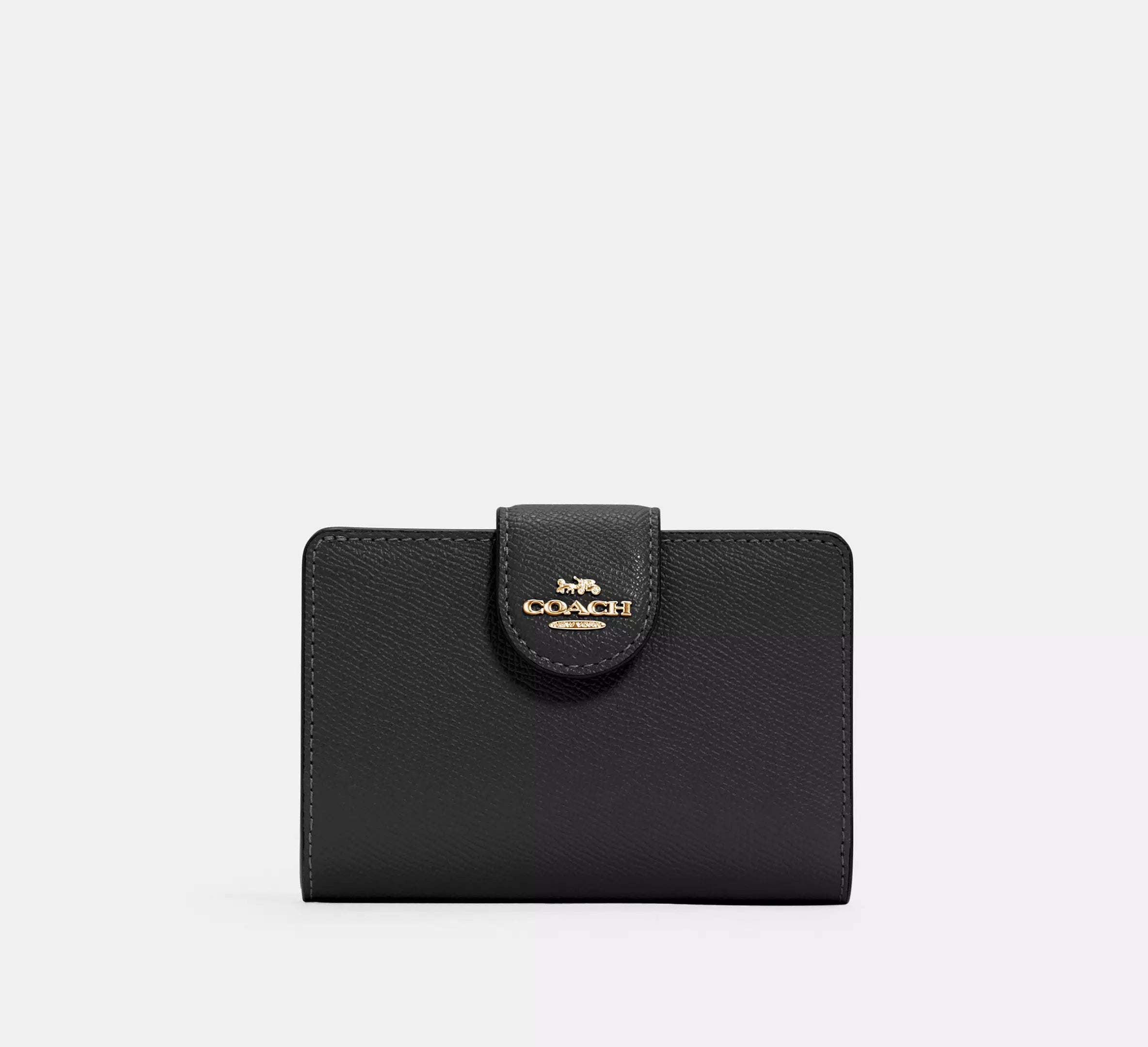 Cartera mediana con cremallera en las esquinas de Coach 