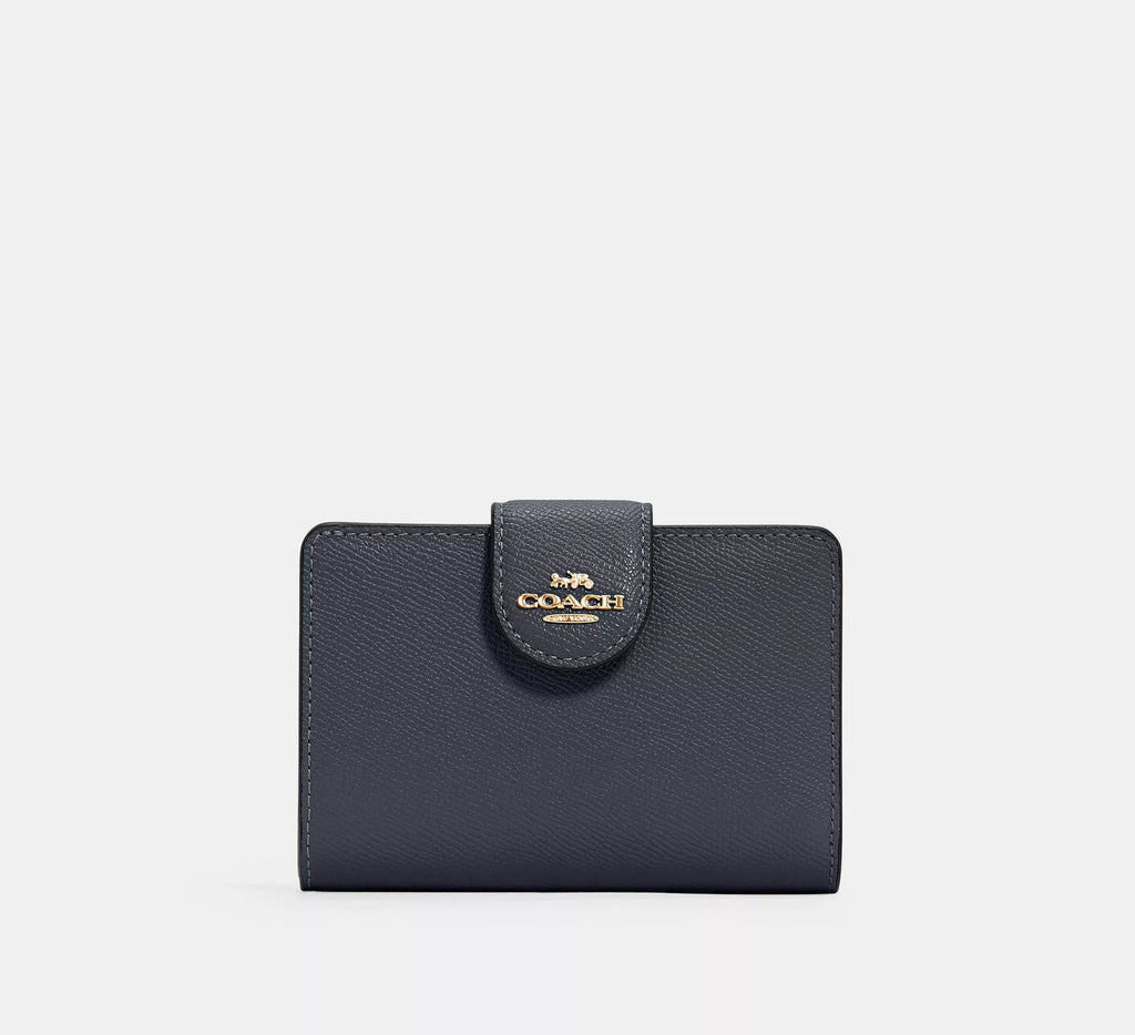 Cartera mediana con cremallera en las esquinas de Coach 