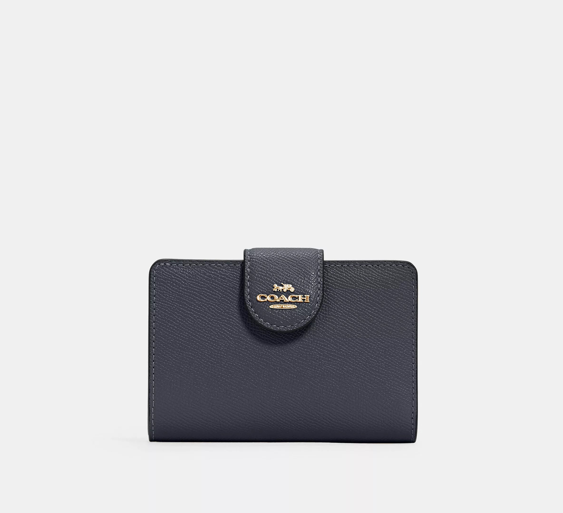 Cartera mediana con cremallera en las esquinas de Coach 