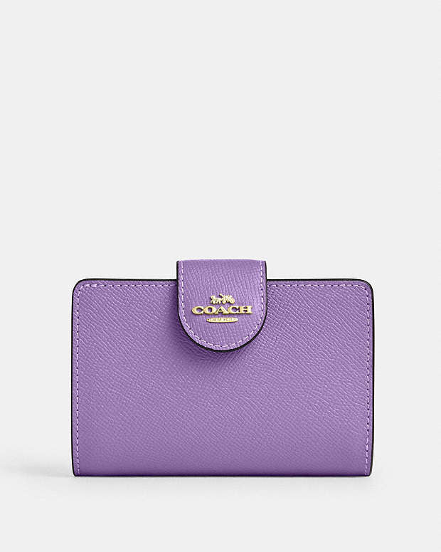 Cartera mediana con cremallera en las esquinas de Coach 