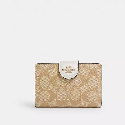 Cartera mediana con cremallera en las esquinas de Coach 