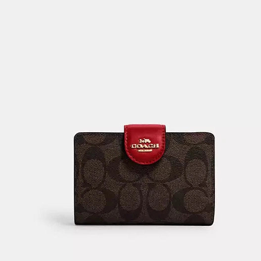 Cartera mediana con cremallera en las esquinas de Coach 