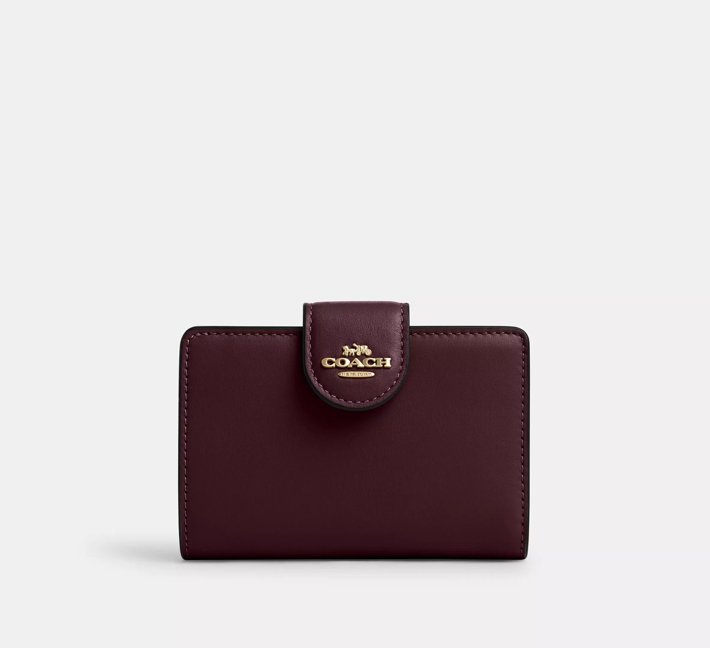 Cartera mediana con cremallera en las esquinas de Coach 