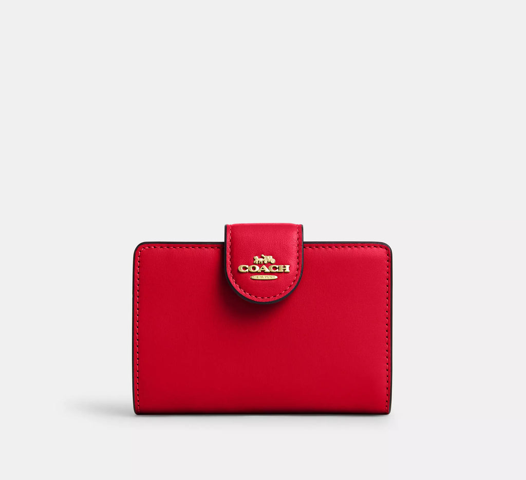 Cartera mediana con cremallera en las esquinas de Coach 
