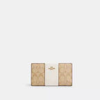 Cartera fina con cremallera de Coach en lona distintiva 