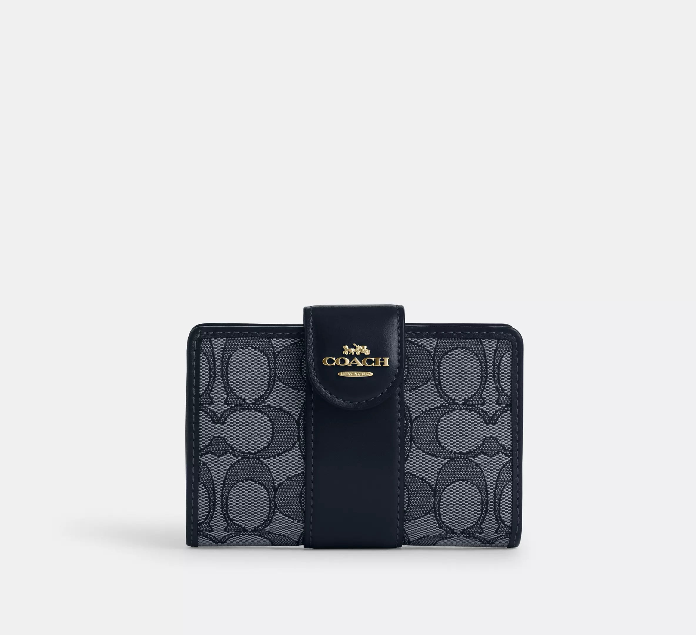 Cartera mediana con cremallera en las esquinas de Coach 