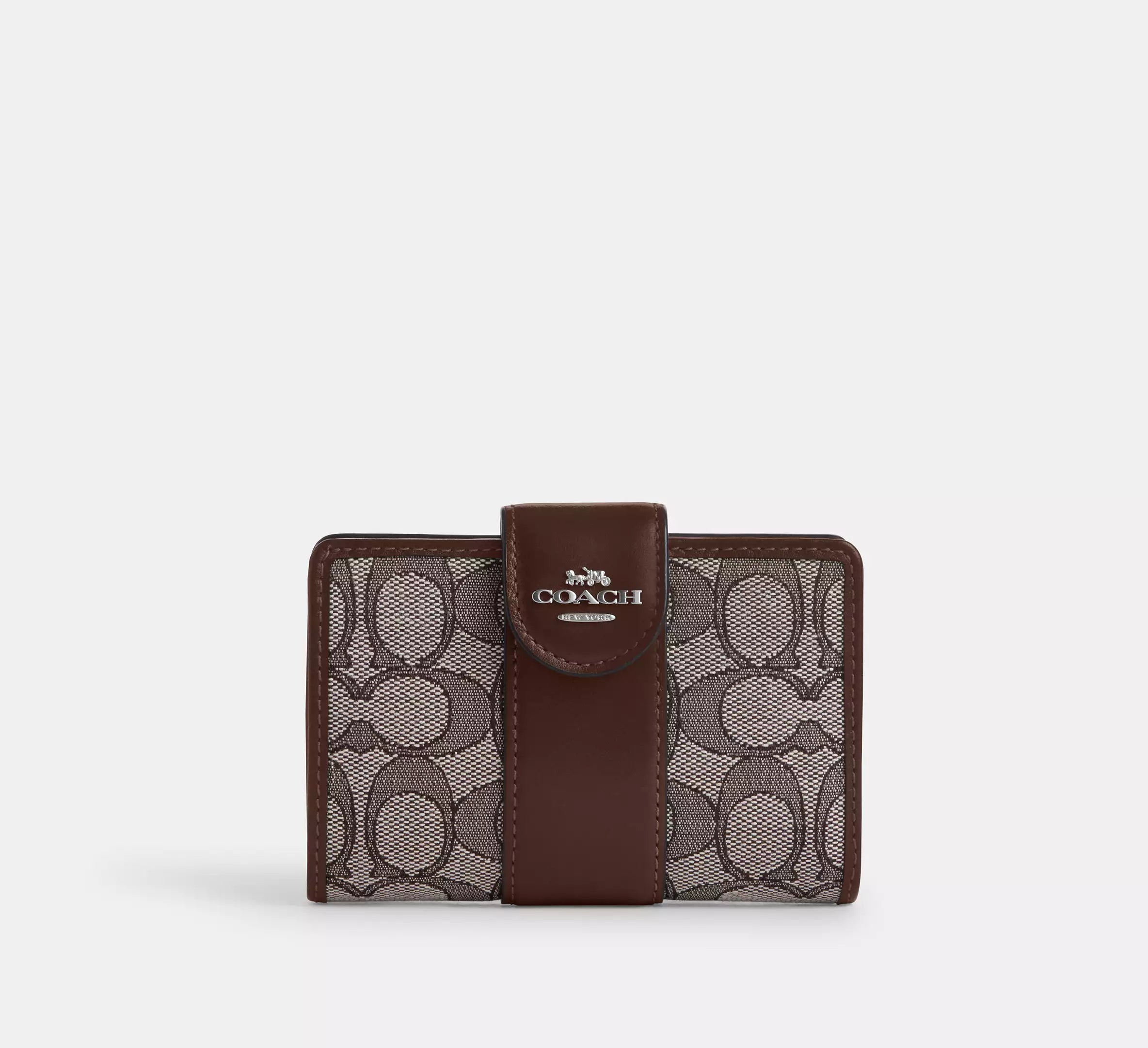 Cartera mediana con cremallera en las esquinas de Coach 