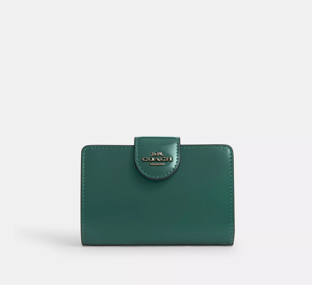 Cartera mediana con cremallera en las esquinas de Coach 