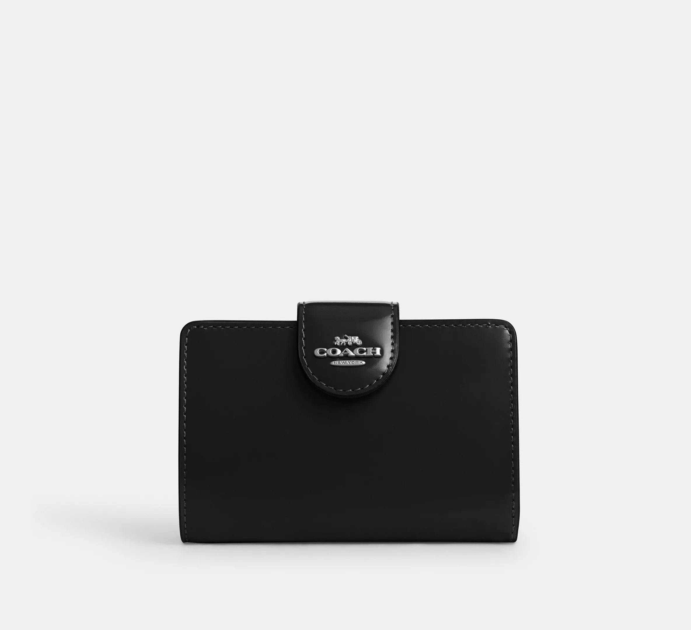 Cartera mediana con cremallera en las esquinas de Coach 