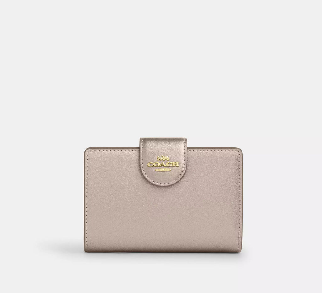 Cartera mediana con cremallera en las esquinas de Coach 