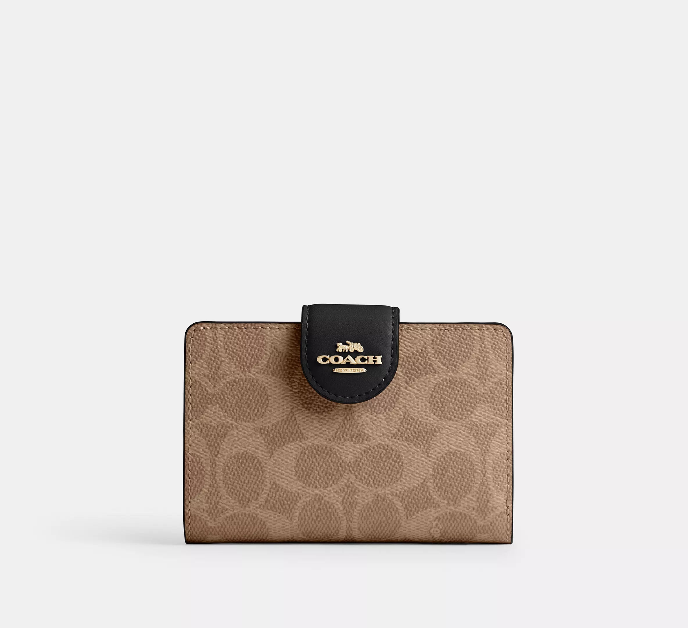 Cartera mediana con cremallera en las esquinas de Coach 