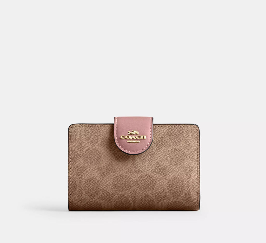 Cartera mediana con cremallera en las esquinas de Coach 