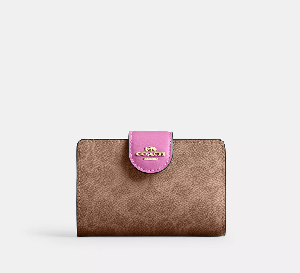 Cartera mediana con cremallera en las esquinas de Coach 