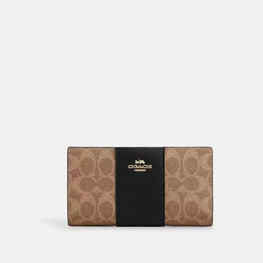 Cartera fina con cremallera de Coach en lona distintiva 