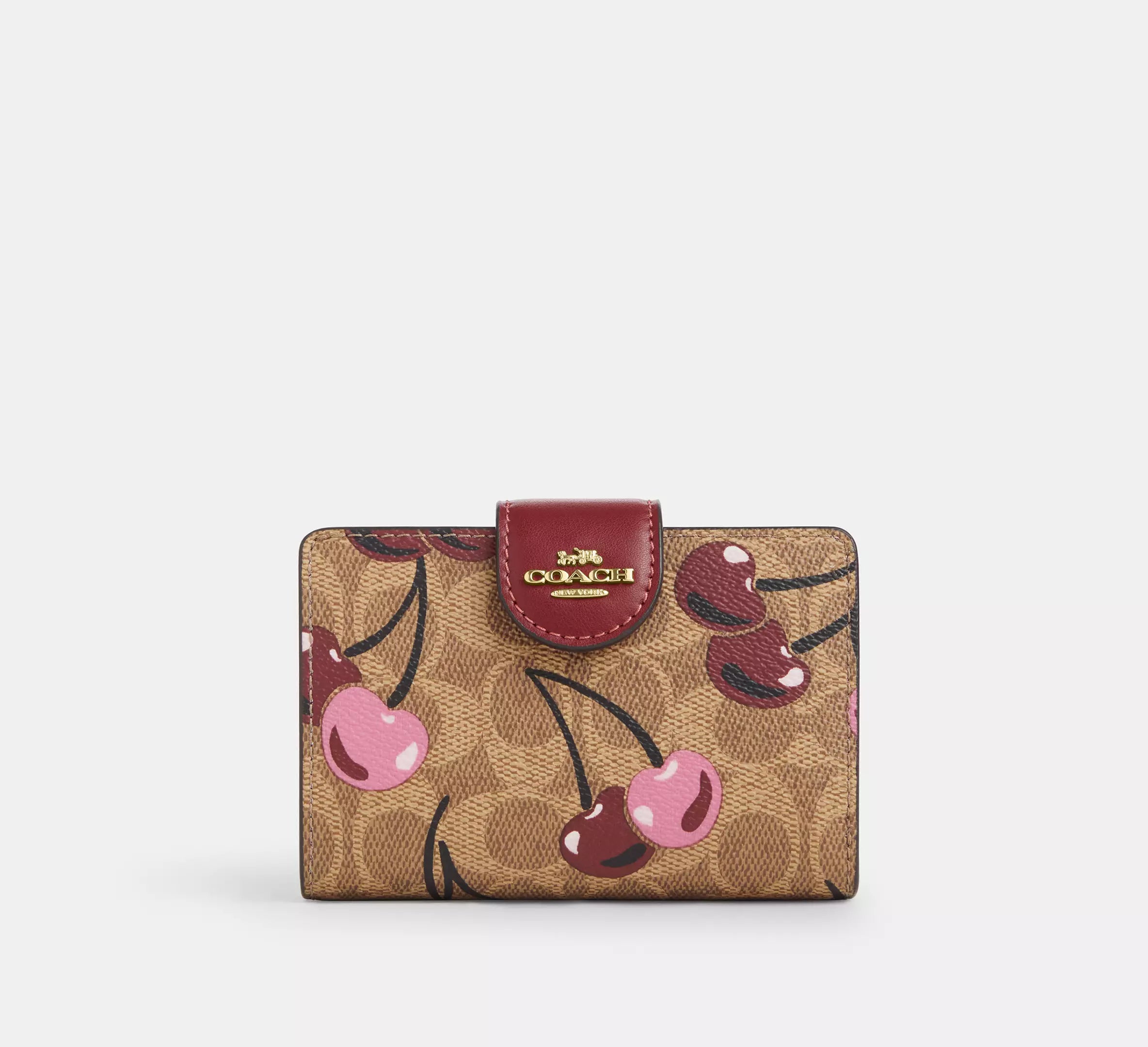 Cartera mediana con cremallera en las esquinas de Coach 