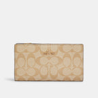 Cartera fina con cremallera de Coach en lona distintiva 