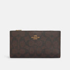 Cartera fina con cremallera de Coach en lona distintiva 